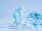 Iceberg in the frozen Mohnbukta in Sabine-Land. Spitzbergen in the Svalbard. Scandinavia, Norway. Art Print